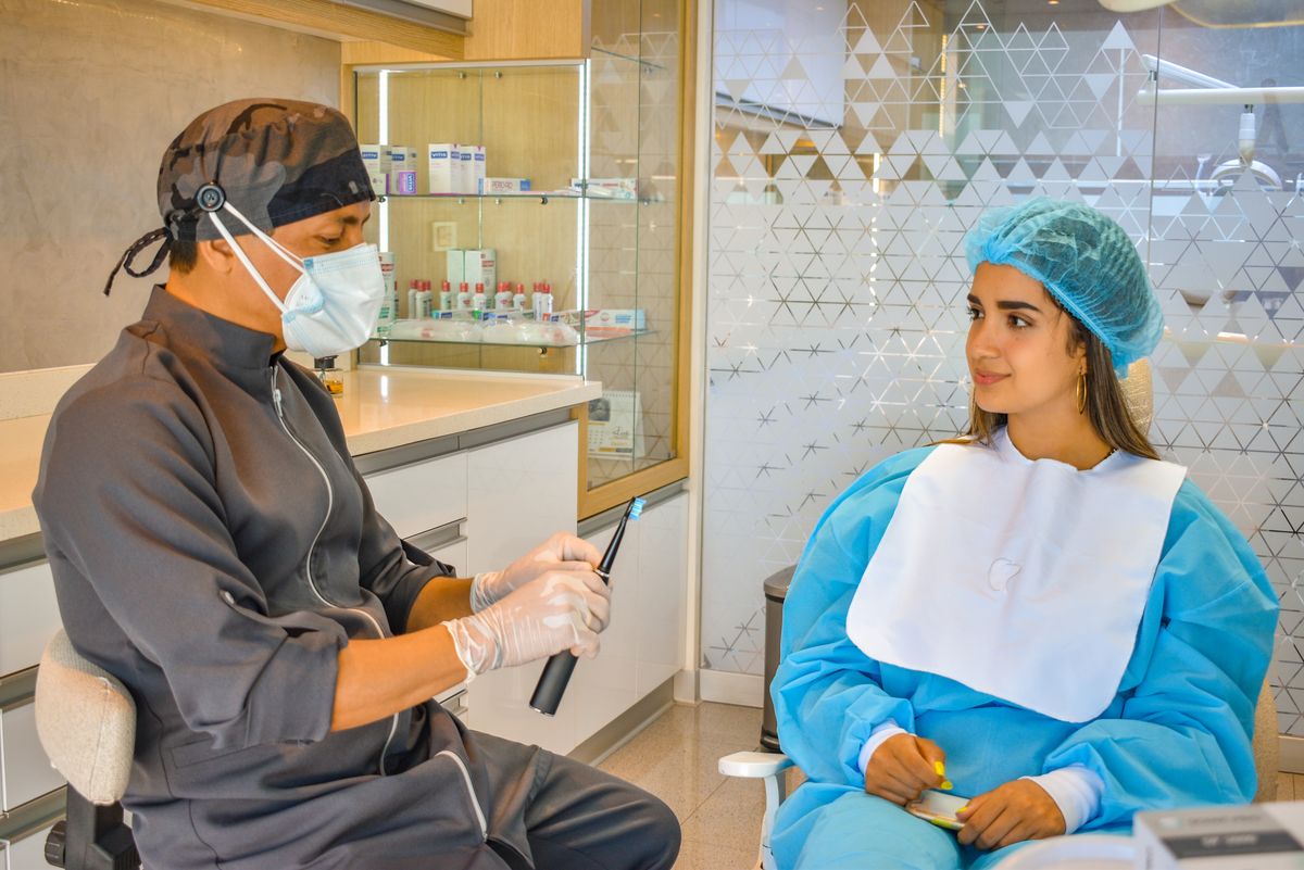Dental crowns and bridges Kharghar — dentist consulting a patient at Dr. Pithadia's Dental Clinic, Sector 14