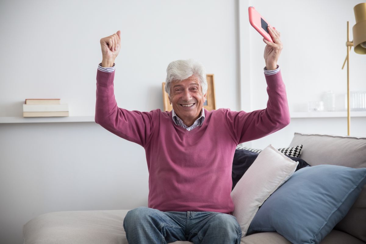 Dentures Sector 14 Kharghar — happy senior man at home, denture patient of Dr. Pithadia's Clinic